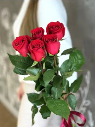 A bouquet of tall red roses