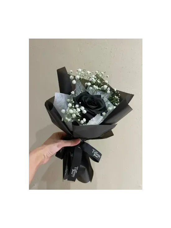Bouquet of black rose and gypsophila
