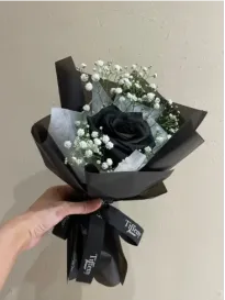 Bouquet of black rose and gypsophila